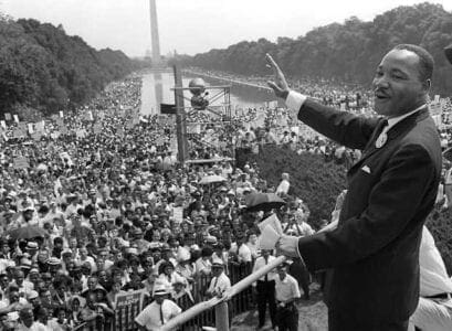 : 	WASHINGTON, UNITED STATES: US civil rights leader Martin Luther King,Jr. (C) waves to supporters from the steps of the Lincoln Memorial 28 August 1963 on the Mall in Washington DC (Washington Monument in background) during the 'March on Washington'. 28 August marks the 40th anniversary of the famous 'I Have a Dream' speech, which is credited with mobilizing supporters of desegregation and prompted the 1964 Civil Rights Act. Martin Luther King was assassinated on 04 April 1968 in Memphis, Tennessee. James Earl Ray confessed to shooting King and was sentenced to 99 years in prison. AFP PHOTO/FILES (Photo credit should read AFP/AFP/Getty Images)